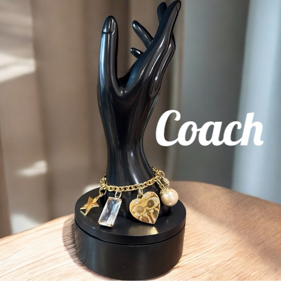 Coach Gold Tone Multi Charm Bracelet. Includes locket Heart, Bird, Star and more - Picture 7 of 17